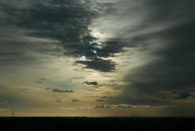 Scenic view of landscape against cloudy sky
