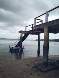 Pier over sea against sky