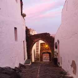 Archway of historic building against sky