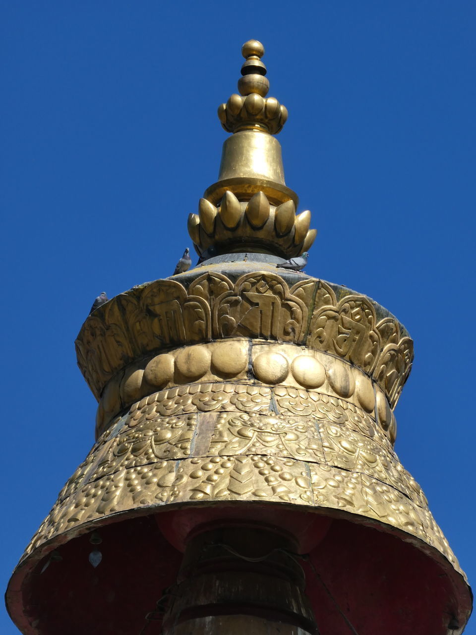 LOW ANGLE VIEW OF CROSS AGAINST BLUE SKY