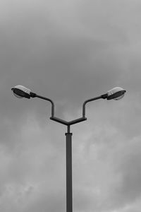 Low angle view of street light against sky