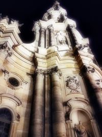 Low angle view of temple against sky at night