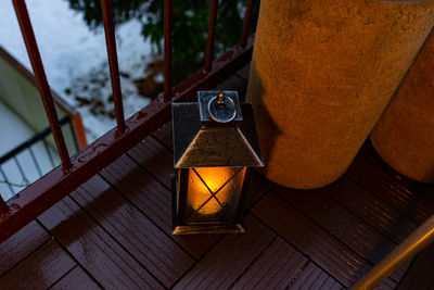 High angle view of illuminated lantern on table