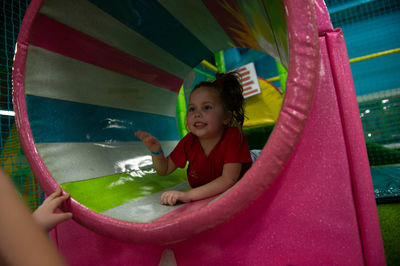 Children play a variety of games in fun room