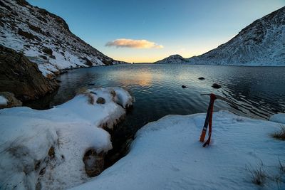 Scenic view of snow covered mountains against sky