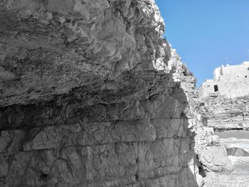 Rock formations on mountain against sky