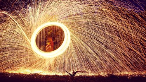 Blurred motion of man with sparklers