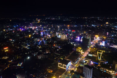 High angle view of illuminated city buildings at night