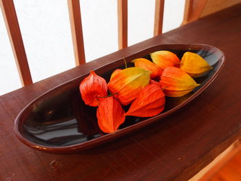 High angle view of orange flower on table