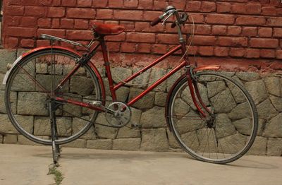 Bicycle leaning on wall