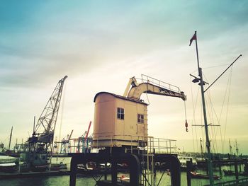 Harbor against cloudy sky