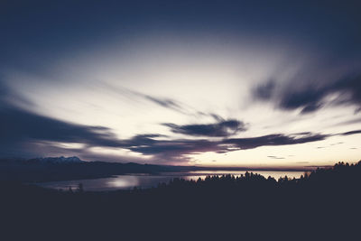 Scenic view of silhouette landscape against sky during sunset