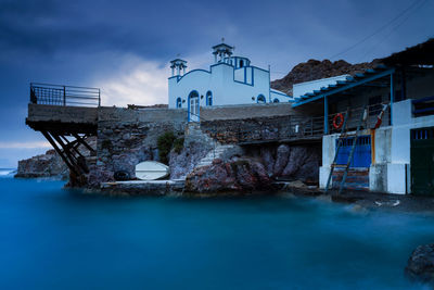 View of boat houses in firopotamos fishing village on milos island in