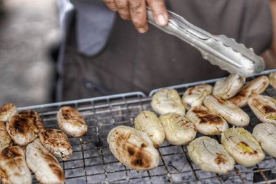 Midsection of man preparing food