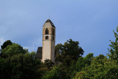 Low angle view of bell tower against sky