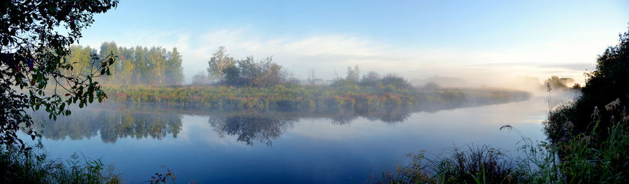 Panoramic view of river in forest during foggy weather