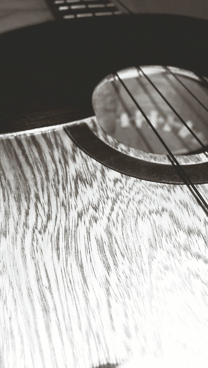 indoors, still life, close-up, table, single object, high angle view, pattern, no people, selective focus, focus on foreground, reflection, shadow, absence, wood - material, simplicity, home interior, art and craft, detail, part of, design