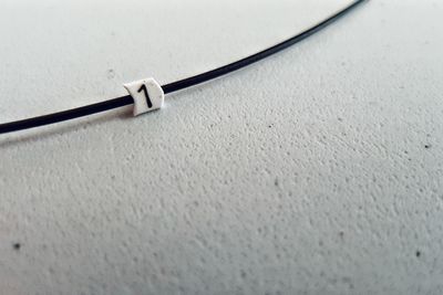 Close up of cable on white surface
