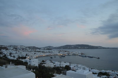 Scenic view of buildings by sea