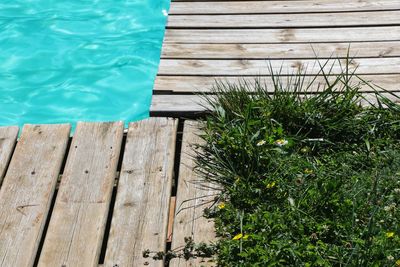 High angle view of swimming pool by lake