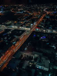 High angle view of illuminated buildings in city at night