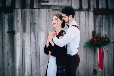 Young couple standing outdoors