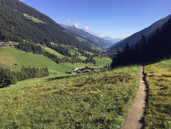 Scenic view of landscape and mountains against sky