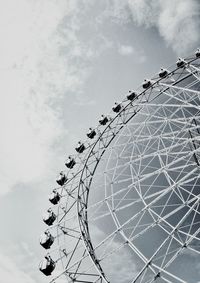 Low angle view of ferris wheel against sky