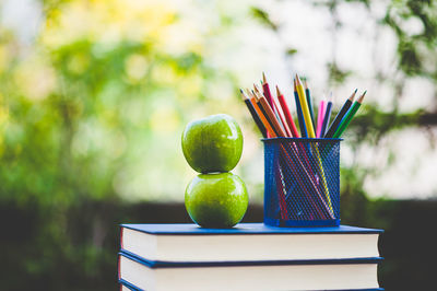 Close-up of multi colored pencils on table