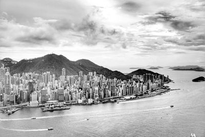 Panoramic view of people on beach against sky