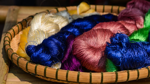 High angle view of multi colored wicker basket on table