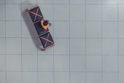 High angle view of multi colored paper on table against wall