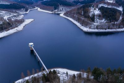 High angle view of snowcapped mountain lake