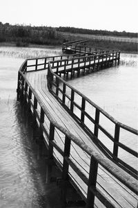 Pier over sea against clear sky