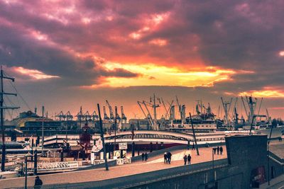 View of boats in sea against cloudy sky