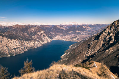 Scenic view of snowcapped mountains against blue sky