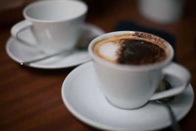 Close-up of coffee cup on table