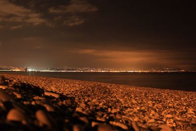 Scenic view of beach against sky at night