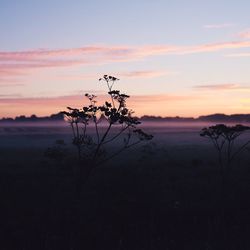 Scenic view of sea against sky at sunset