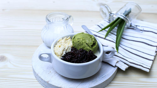 Durian with black sticky rice and coconut milk sauce with matcha ice cream, homemade thailand