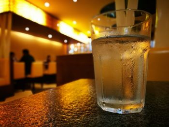 Close-up of beer glass on table