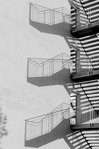 Staircase leading towards building against sky