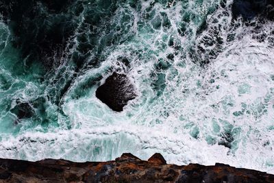 Sea waves splashing on rocks