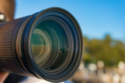 Close up of camera lens. photographer taking photos outdoors