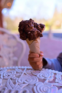 Midsection of person holding ice cream