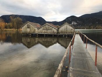 Pier over lake against sky