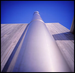 Low angle view of building against clear blue sky