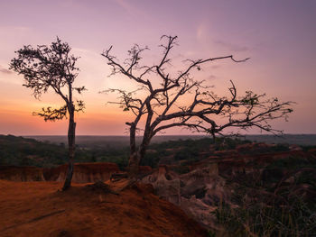 Scenic view of land against sky during sunset