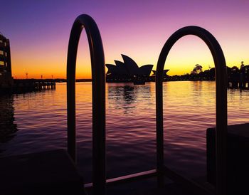 Scenic view of silhouette bridge against sky during sunset