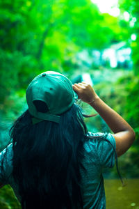 Rear view of woman standing outdoors